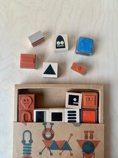 detail of 28 individual wood-backed robot stamps 