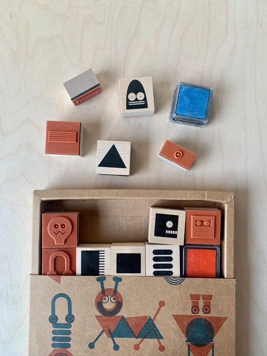 detail of 28 individual wood-backed robot stamps 